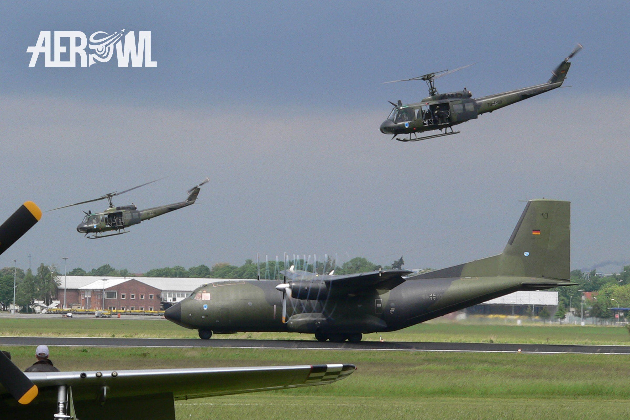 A Bundeswehr Transall C-160 action start during an military presentation with two Bell UH-1D "Hueys" as back up at the SFX airport in Berlin/Brandenburg, Germany during the ILA 2006.