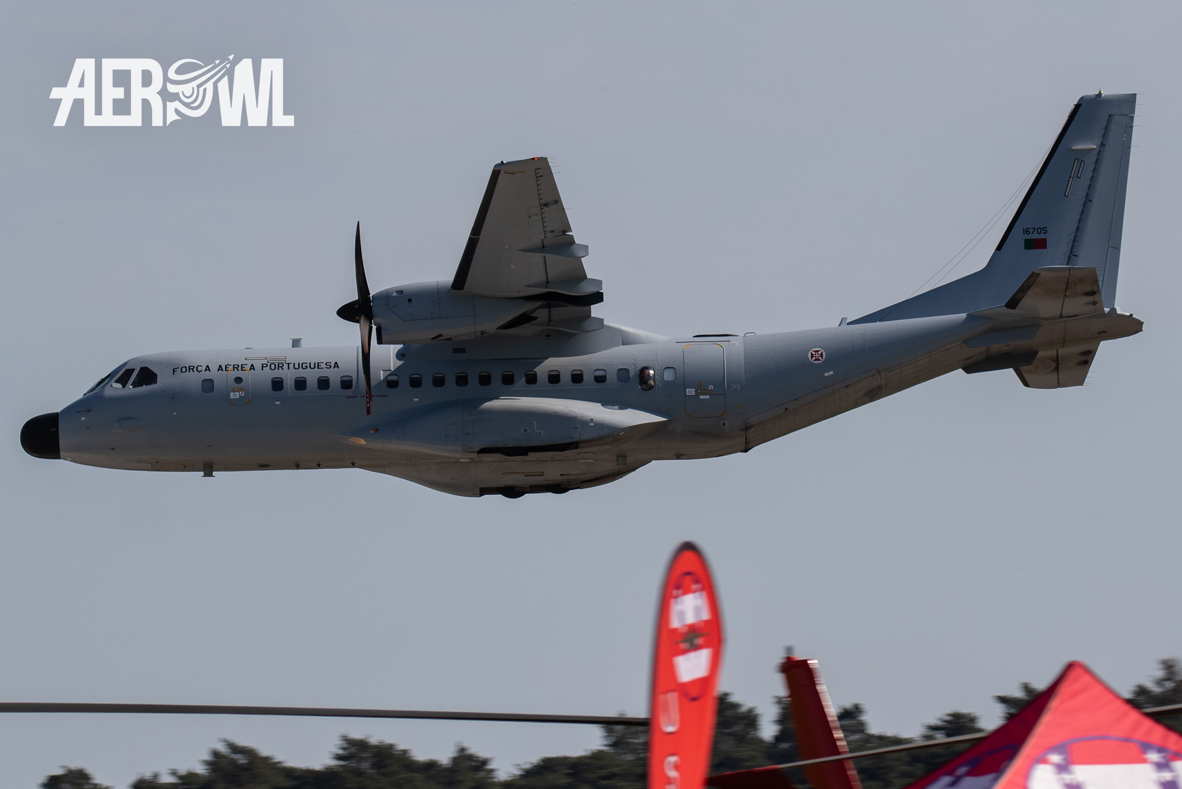 A Portuguese Air Force CASA C-295M flies past at low level over the runway during the ILA2018 the BER airport in Berlin/Brandenburg, Germany.