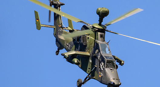 A Bundeswehr Eurocopter Tiger UHT (EC665) diving during its air display at the ILA 2018 for the audience at the BER airport Berlin-Brandenburg in Germany.