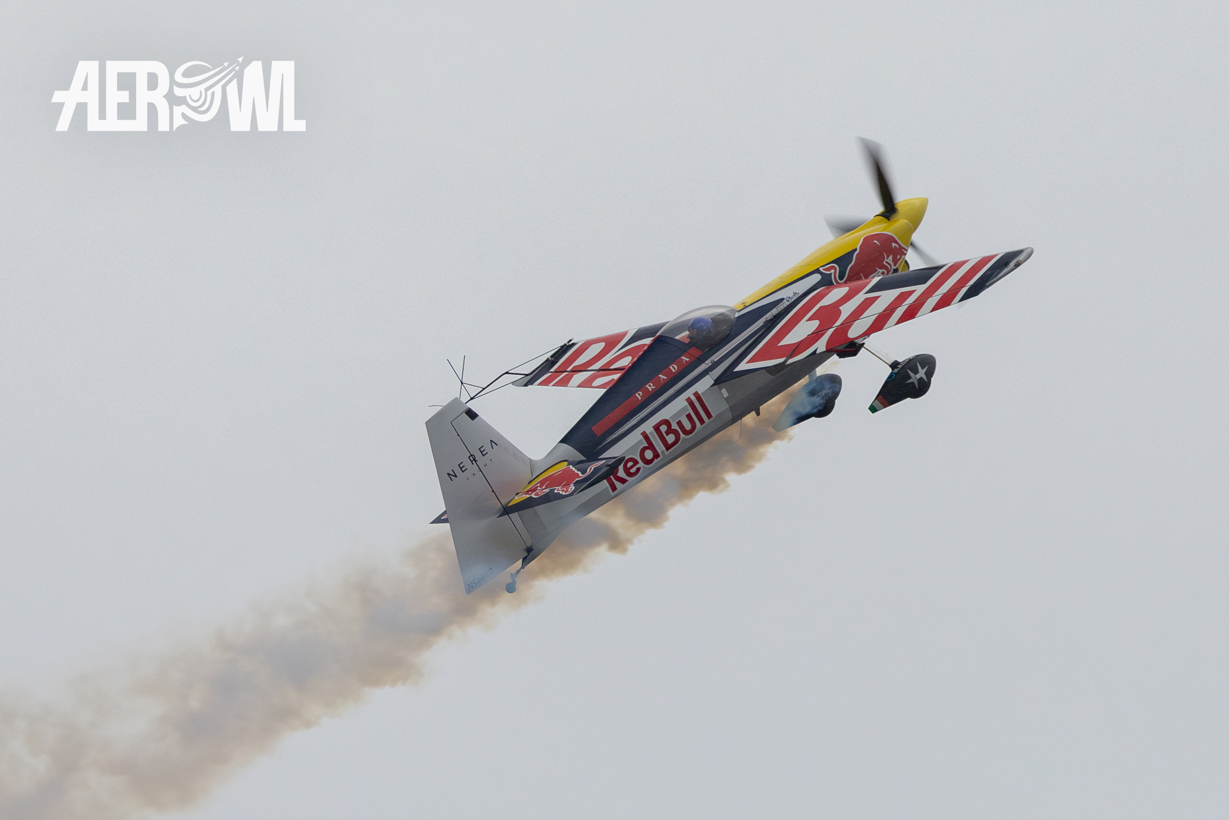 An hard climbing Extra 300 LX of the Flying Bulls Helicopter demo team presenting a smoky show at the AirPower24 in Zeltweg, Austria.