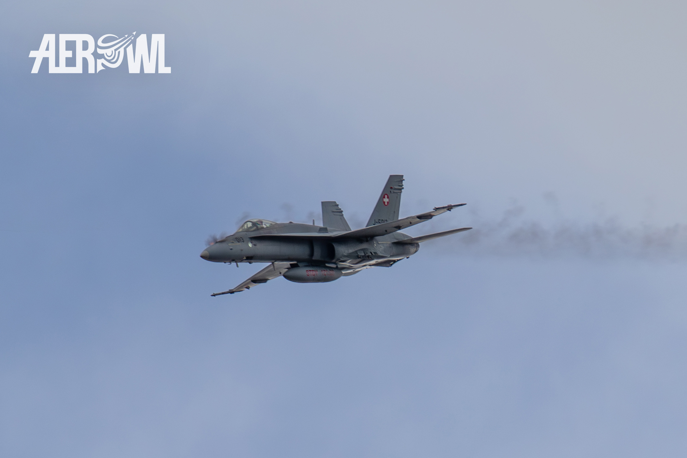 A Swiss Air Force Boeing F/A-18C Hornet fires its 20mm cannon during the Axalp Fliegerschiessen 2018 in the Swiss Alps.