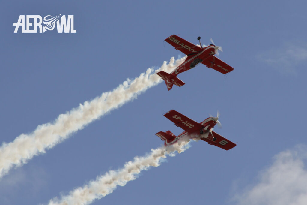 Grupa Akrobacyjna ลปelazny in their Extra-330LC performing at the ILA 2014 over the runway of the BER airport in Berlin/Brandenburg, Germany.