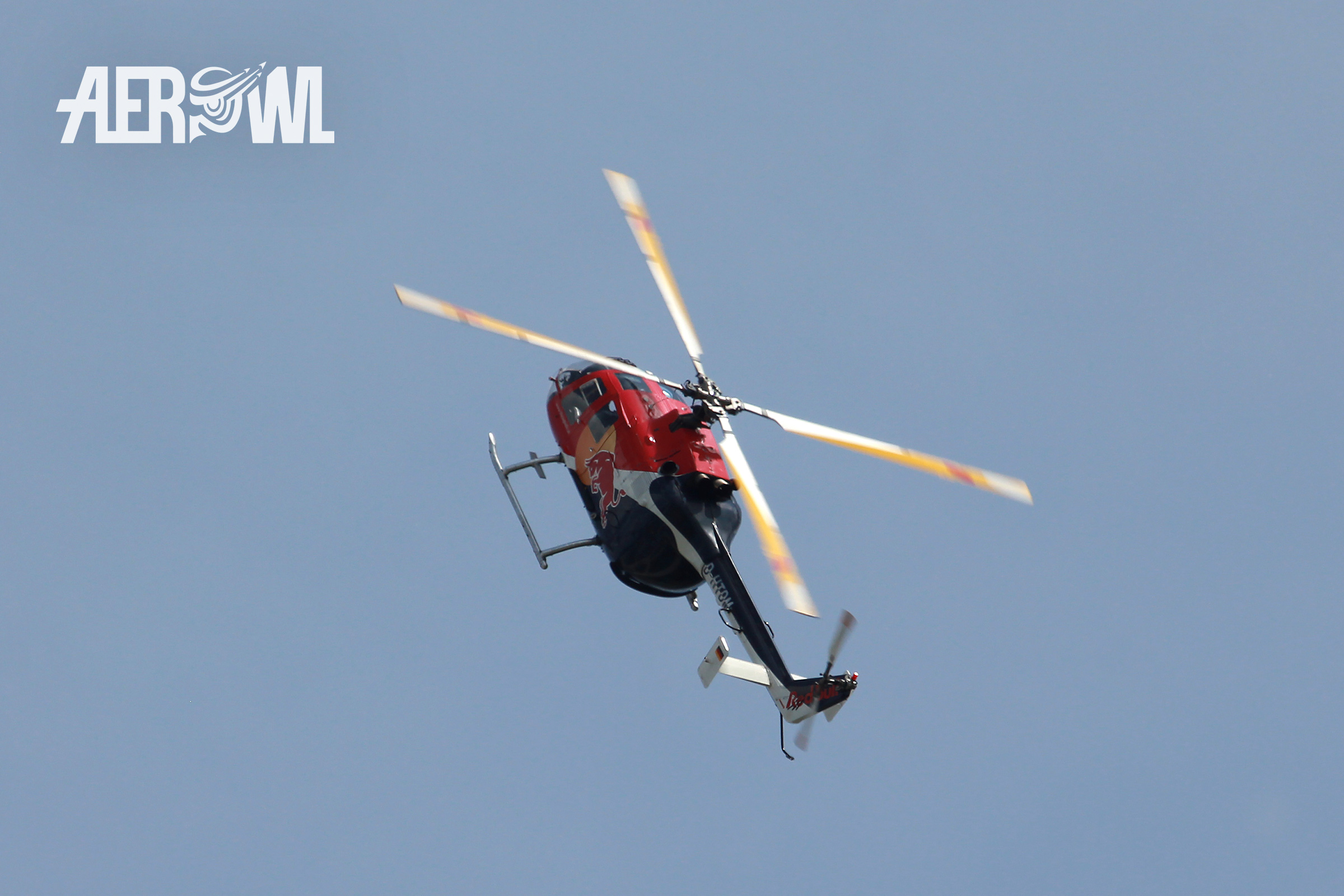 A Red Bull MBB BO-105 rising during an airdisplay at the ILA 2014 at the BER airport Berlin-Brandenburg in Germany.