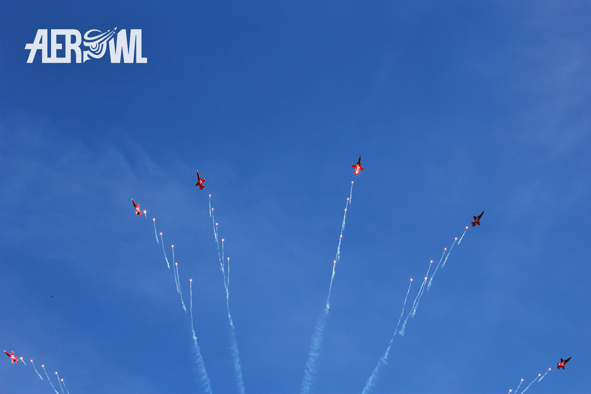 The great Patrouille Suisse "grande finale" with a lot of hot flares. A stunning moment for the impressed audience at the Axalp 2022 airshow in the Swiss mountains.