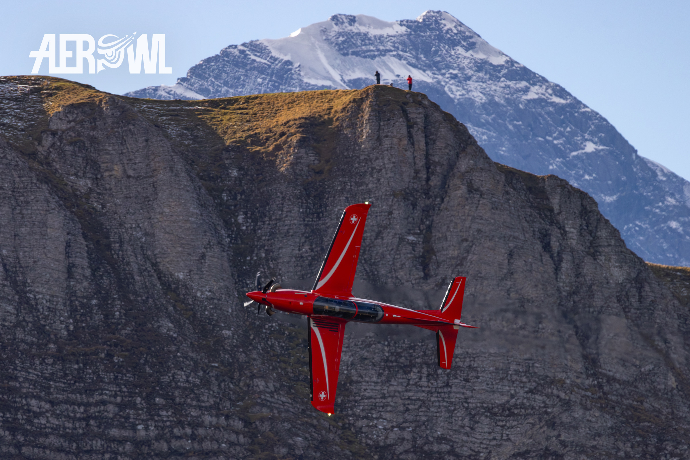 A red Swiss Air Force Pilatus PC-21 with the wonderfull Jungfrau Mountain in the background during the Axalp 2023 in Switzerland.