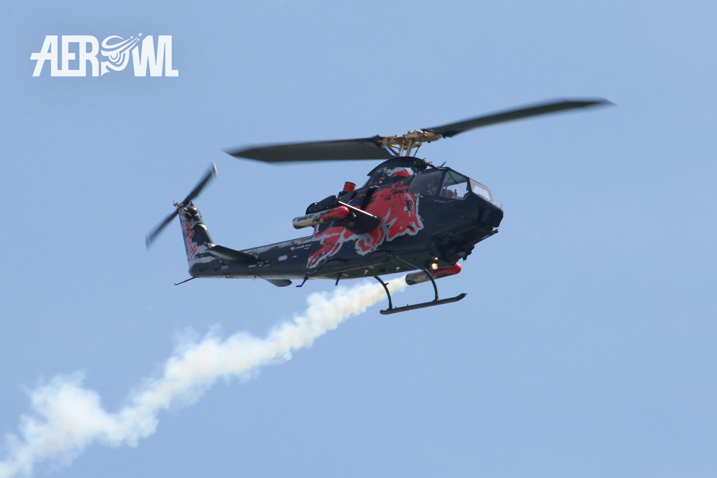 The legendary Red Bull Cobra (Bell 209/AH-1F "Huey Cobra") during an air display at the ILA 2014 at the BER airport Berlin-Brandenburg in Germany.
