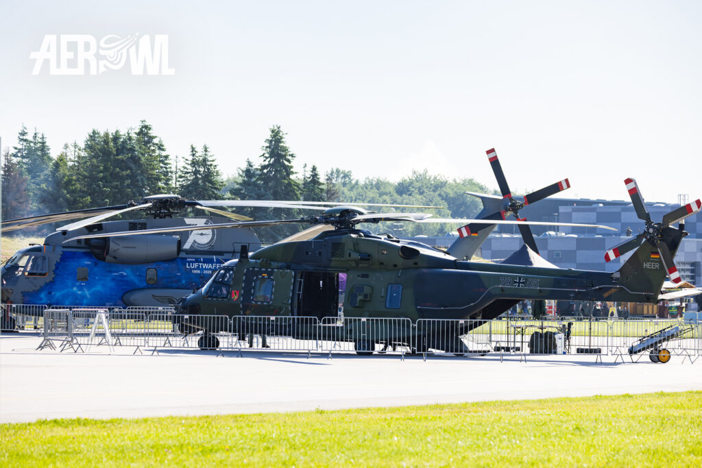 An NH90 and a CH-53 in the static display area during the Tag der Bundeswehr 2026 at Fliegerhorst Laage in Germany.