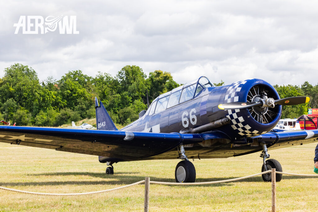 Static display of a blue 1953 Canadian Car and a Founry Harvard Mk IV “D – FSIX” at the bee farm in Brandenburg as part of the “Stearman & Friends 2026” event.