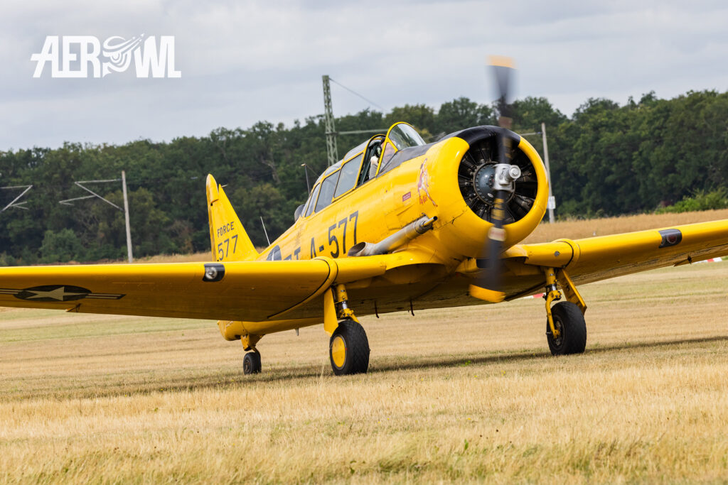 A yellow Harvard Mk IV "D – FATE” built by Canadian Car and Foundry taxis off the runway after landing at the bee farm in Brandenburg as part of the “Stearman & Friends 2026” event.