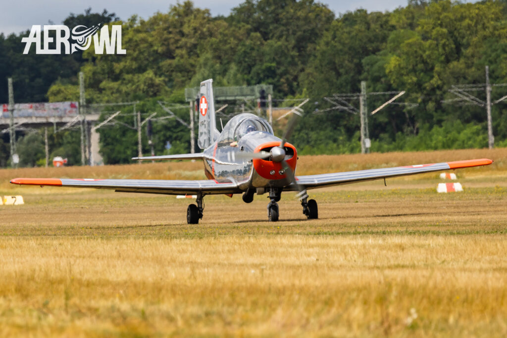 A Pilatus P3-05 in its original paint scheme, with the registration F-AZQQ, taxis back to its parking spot at the Bienenfarm in Brandenburg after its air show performance at Stearman and Friends 2026.